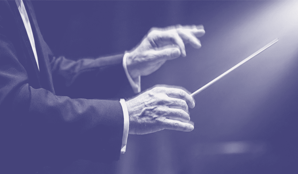 POR QUE O MAESTRO NÃO PARA DE MOVER AS MÃOS_ Descubra a história por trás do silêncio que guia o som. Banner Blog